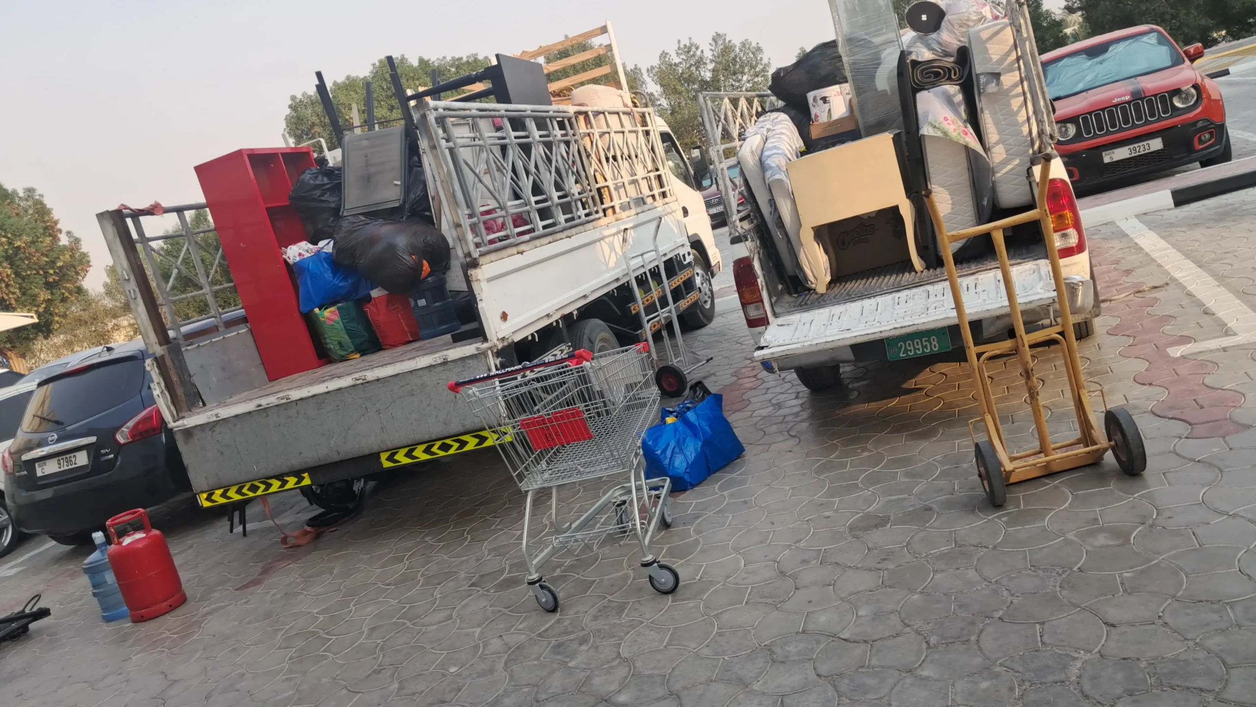 Junk removal truck collecting unwanted furniture and waste in Dubai